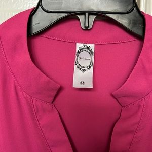 Beautiful Pink/Fushia top. Roomy and comfortable. True to size.